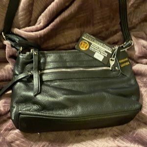 Concealed carry purse. Genuine leather.  Brand new with tags!